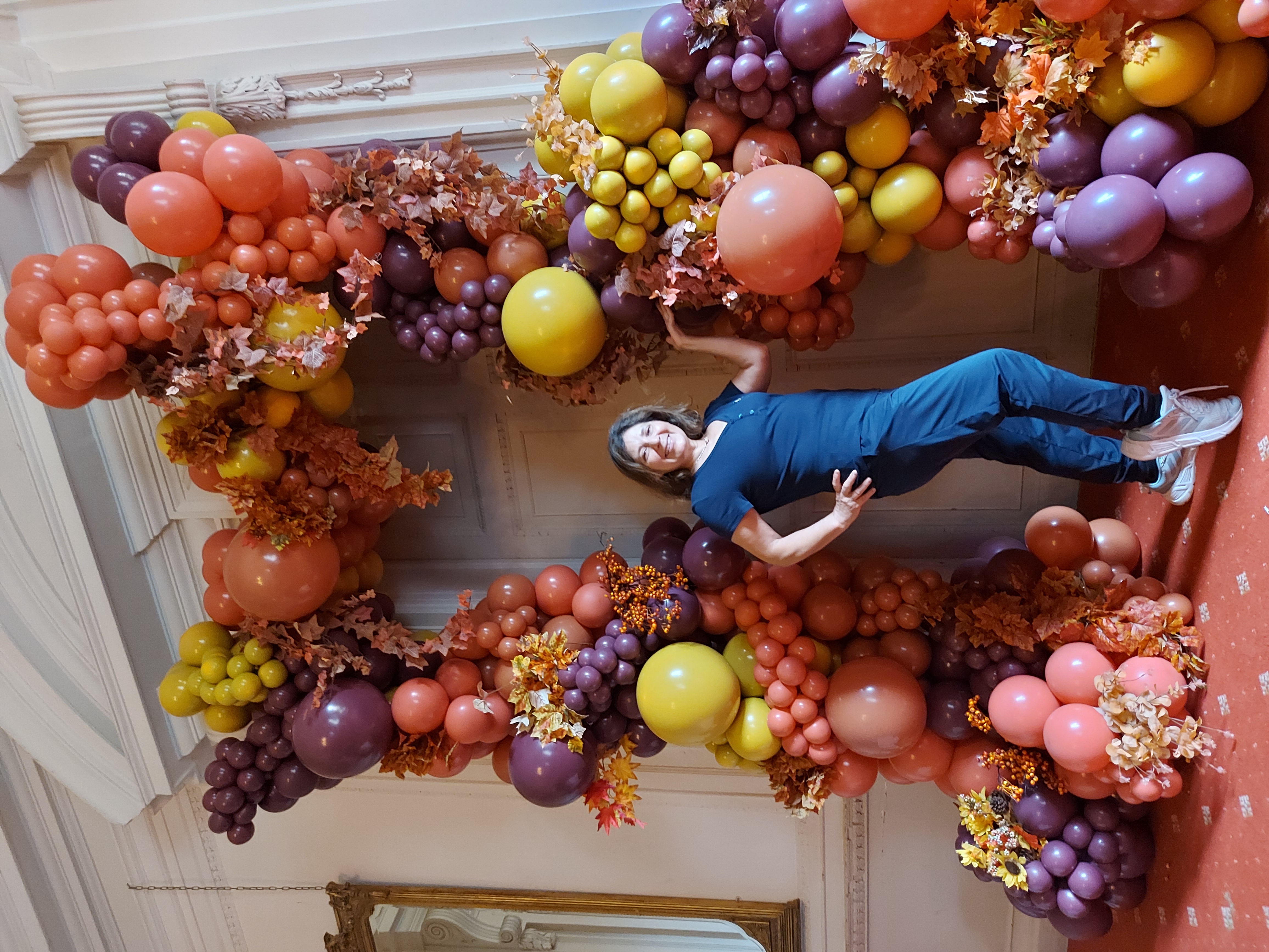 An autumn-themed door arch creates a grandiose entrance
